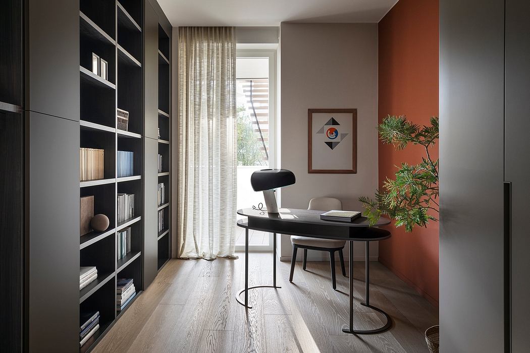 Modern home office with bold, geometric bookcase and minimalist desk setup.