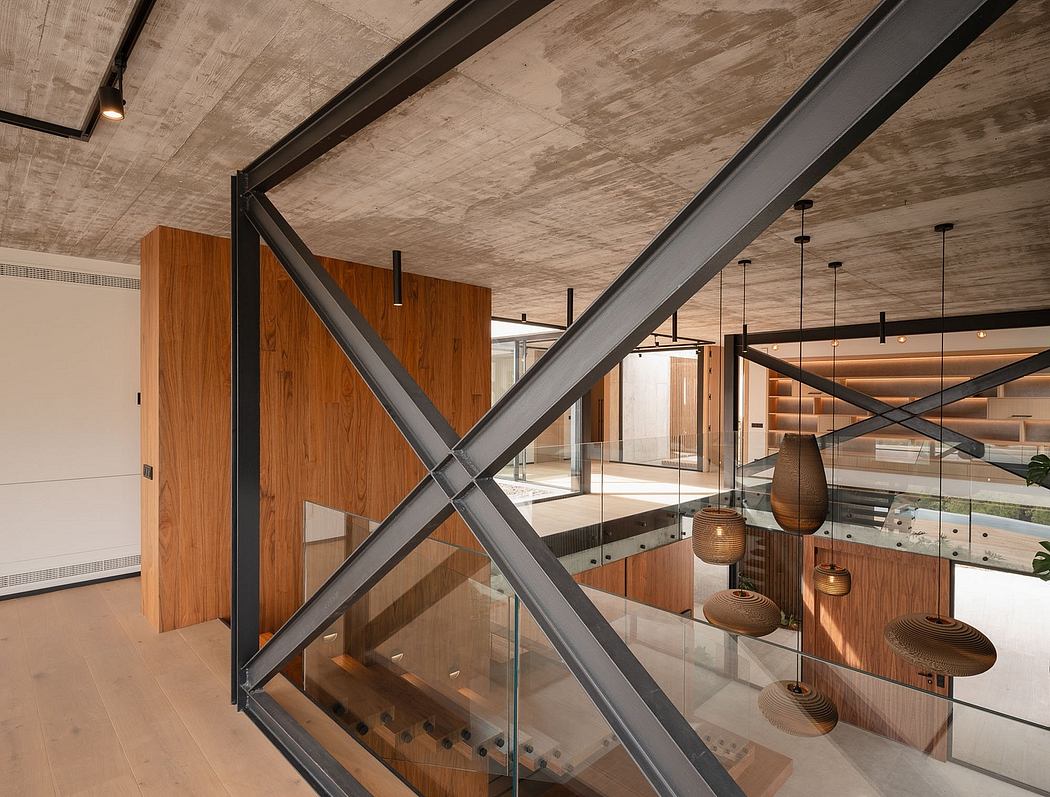 Modern industrial-style interior with exposed concrete ceiling, wooden panels, and steel beams.