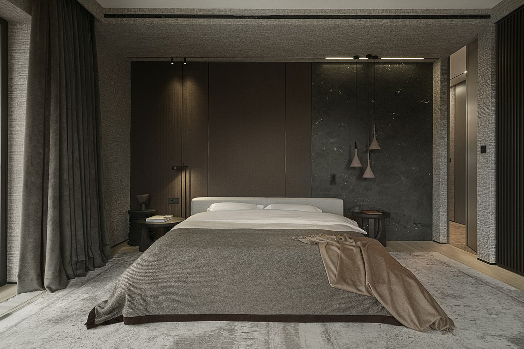 Minimalist bedroom with sleek dark furniture, textured walls, and pendant lighting.