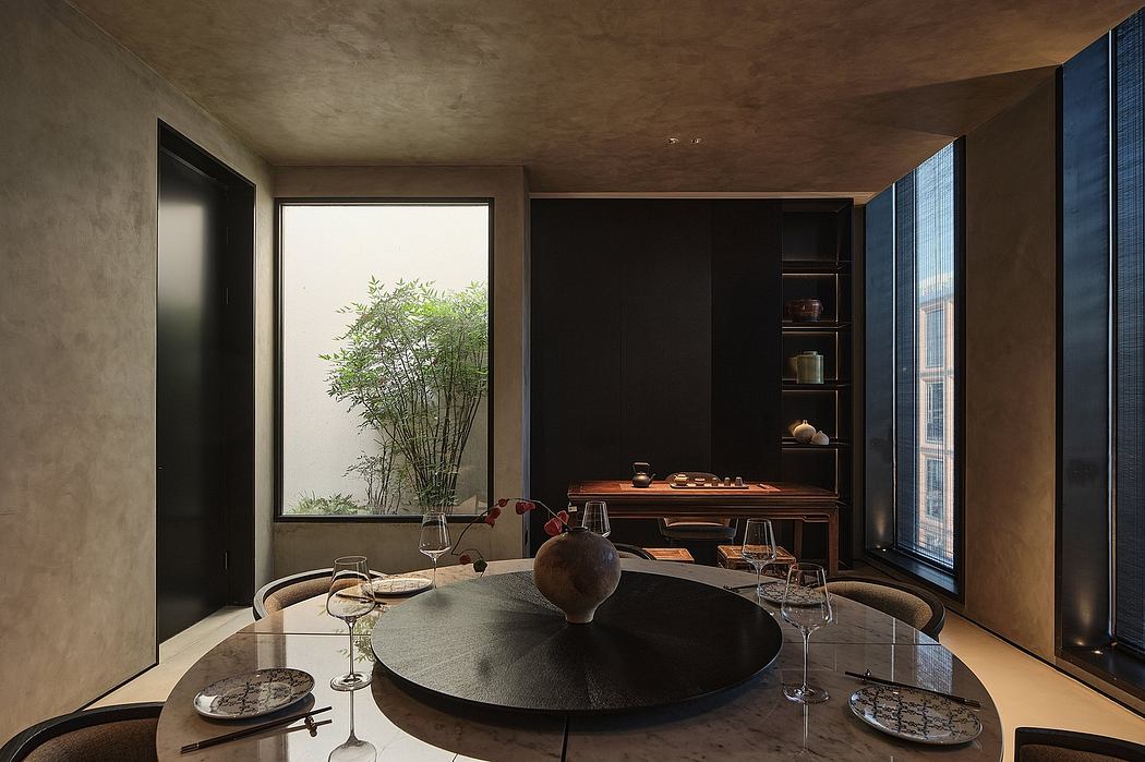 A serene, minimalist dining room with deep wood tones, lush greenery, and striking architectural features.