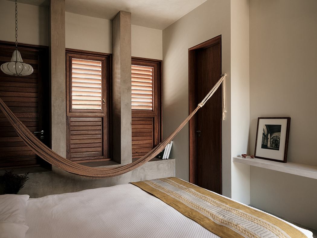 A cozy bedroom with wooden accents, a hammock, and clean architectural lines.