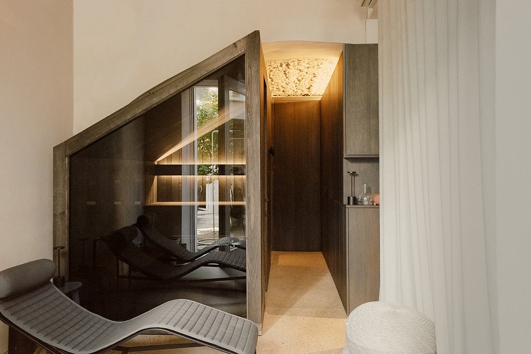 A modern, open-concept interior with geometric lighting and angled architectural details.