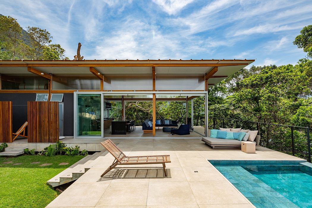 Sleek, modern home with wooden beams, expansive windows, and a serene pool area.