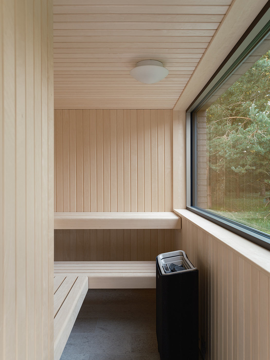 Cozy wooden paneled nook with embedded bench seating and built-in storage.