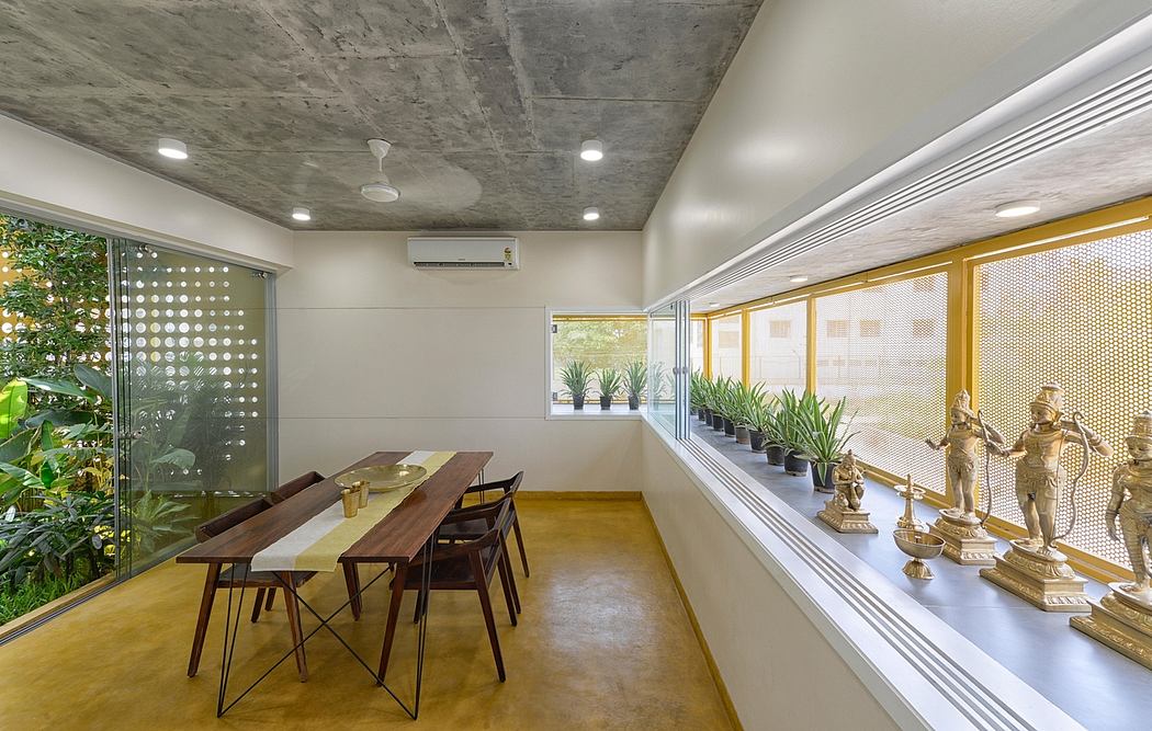 Contemporary dining area with industrial concrete ceiling, wood furnishings, and decorative elements.
