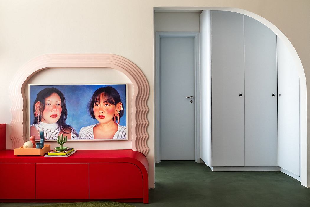 Stylish modern interior with geometric wall panel, red cabinet, and arched doorways.