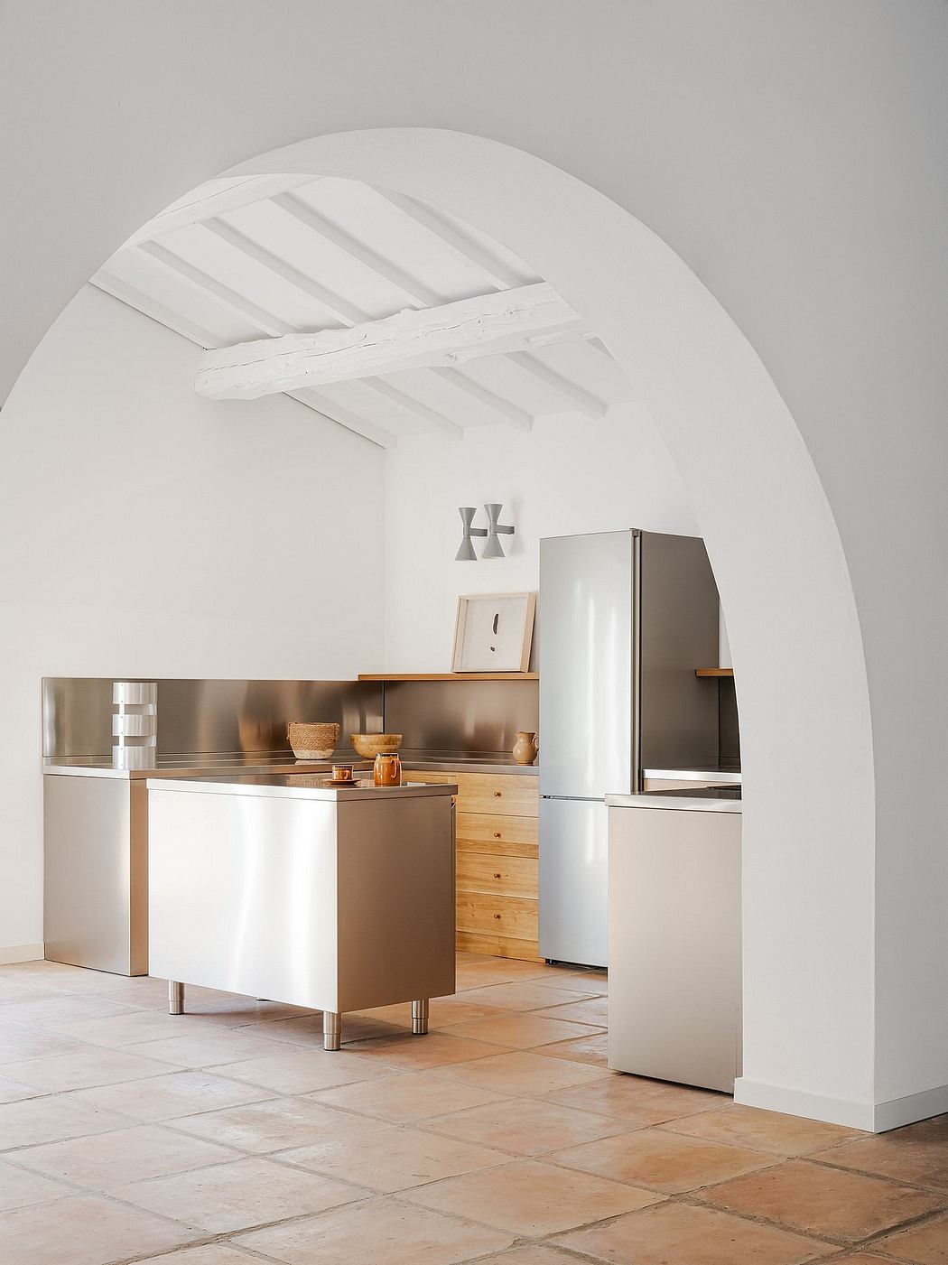 A modern, minimalist kitchen with clean lines, wooden cabinetry, and stainless steel appliances.