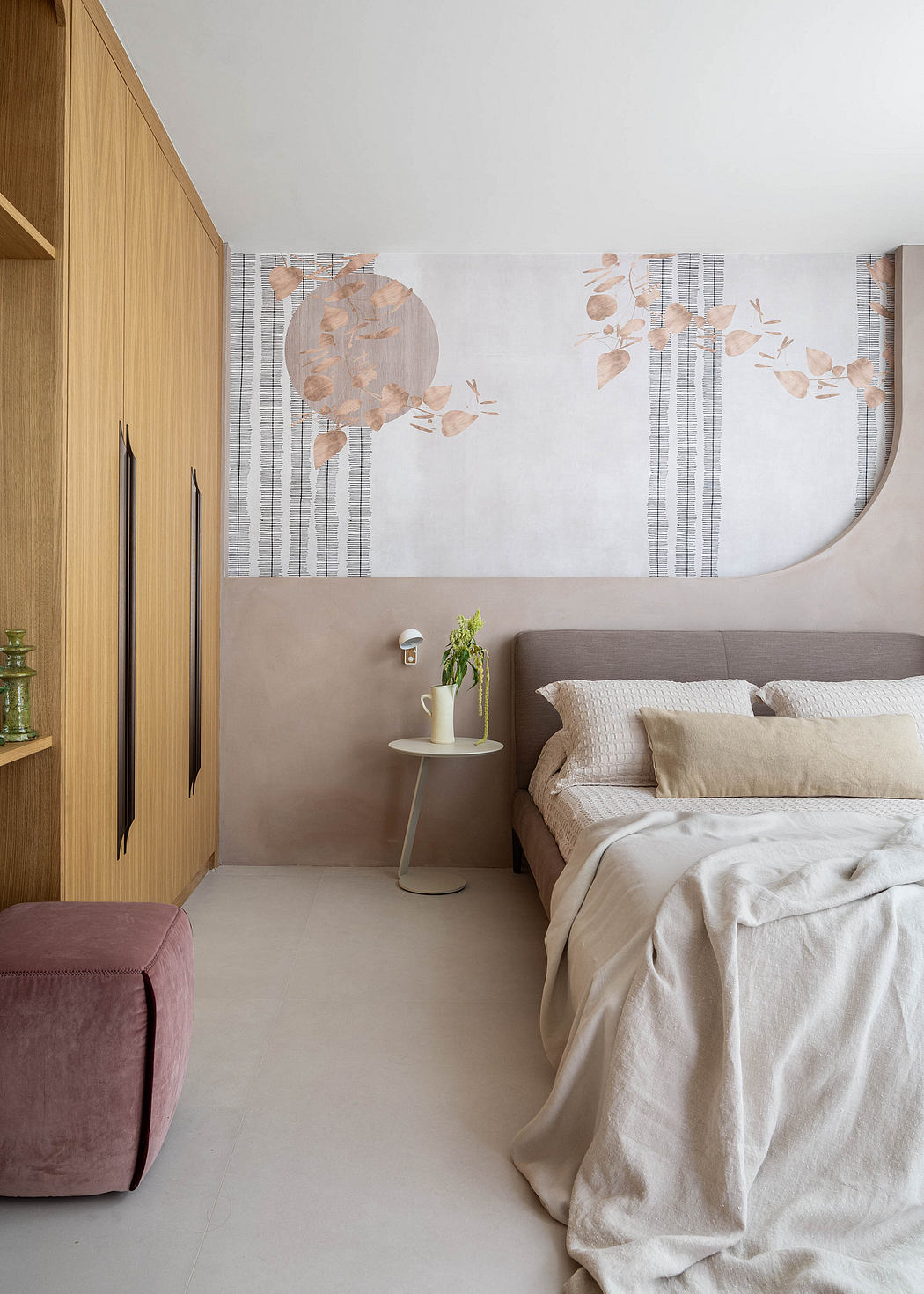 Minimal, soothing bedroom design with textured wall art, neutral colors, and cozy bedding.