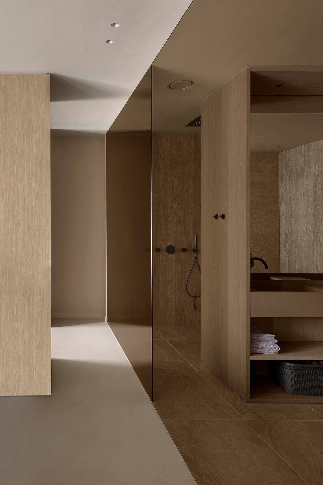 Minimalist bathroom design with wood-paneled walls and recessed lighting.