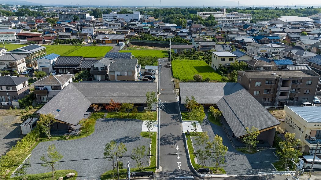 Aerial view of a densely populated urban neighborhood with diverse architectural styles and green spaces.