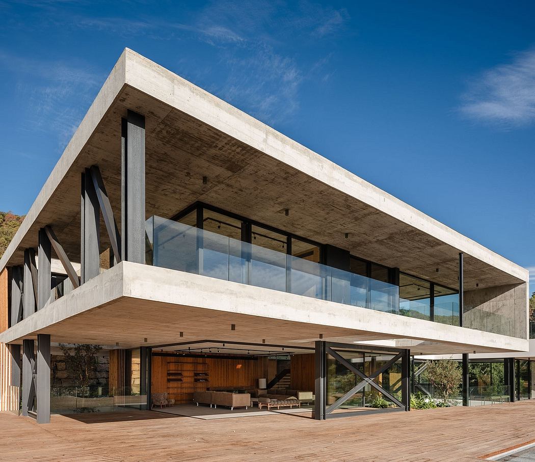 Striking concrete and glass structure with open floorplan and expansive views.