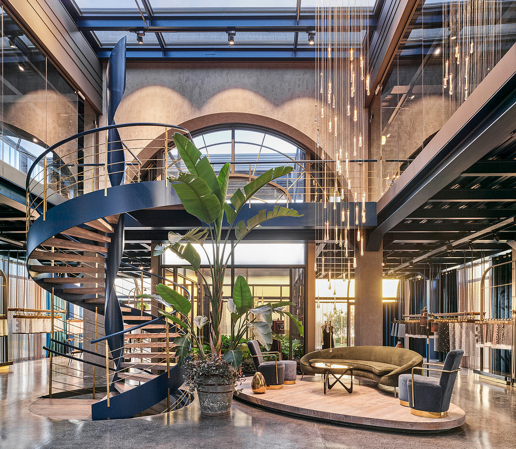Luxurious lobby with spiral staircase, lush plants, and intricate lighting fixtures.