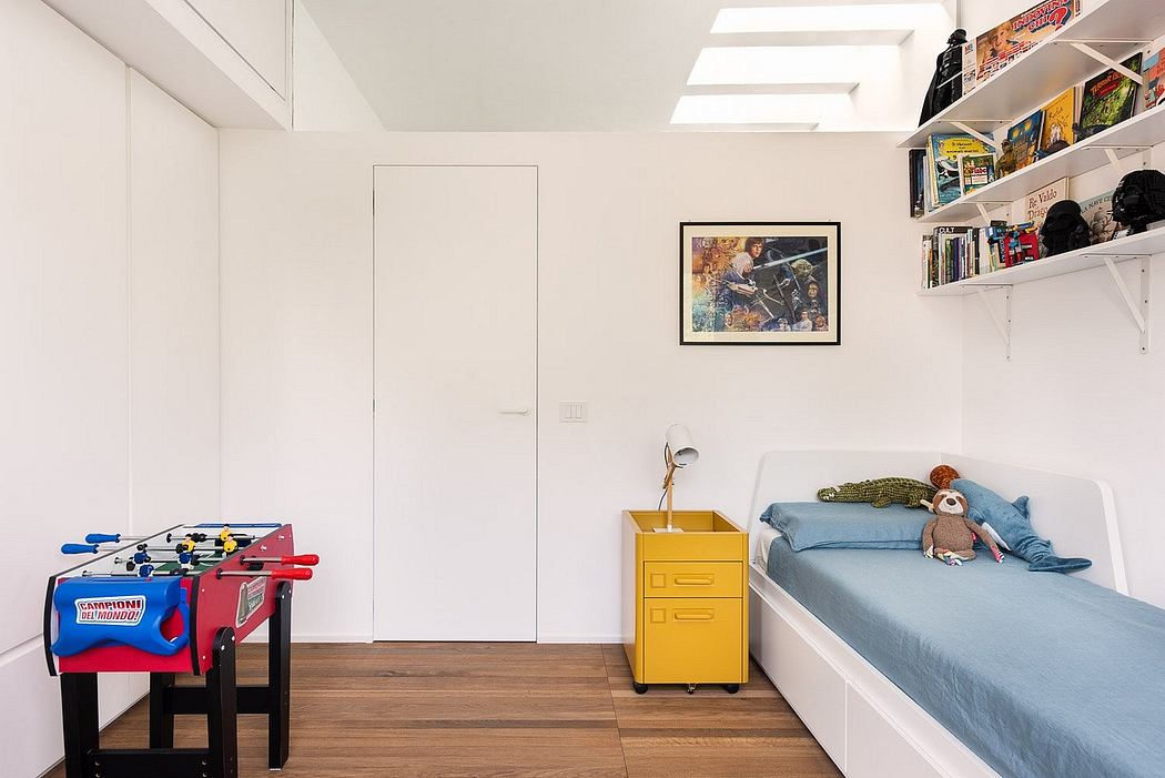 Well-designed room with modern furnishings, shelving, and playful accents creating a cozy, inviting space.