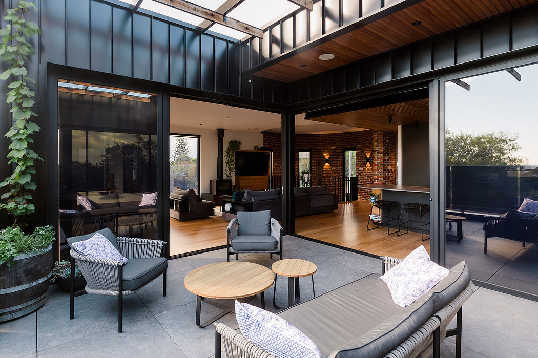 Sleek, modern architecture blends indoor and outdoor living spaces seamlessly.