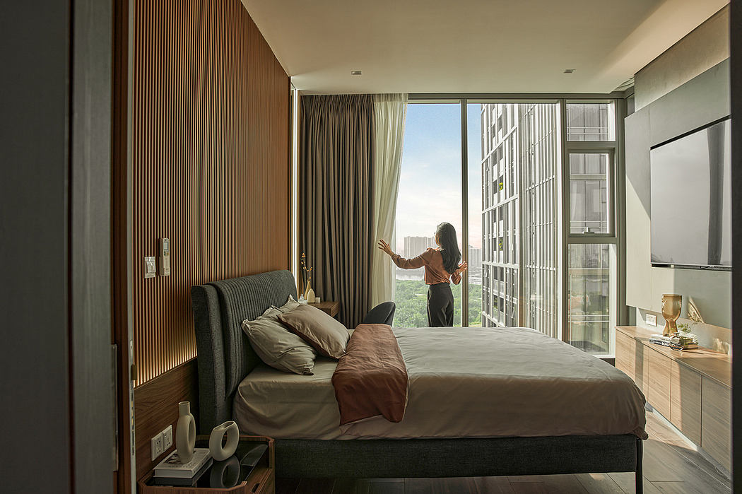 Modern, cozy bedroom with floor-to-ceiling windows, wood-paneled walls, and a plush bed.