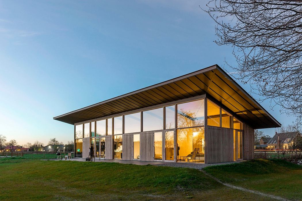 Sleek, modern architecture with wooden panels, large windows, and an overhanging roof.