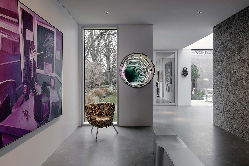 Contemporary interior with abstract artwork, circular mirror, and sculptural chair.