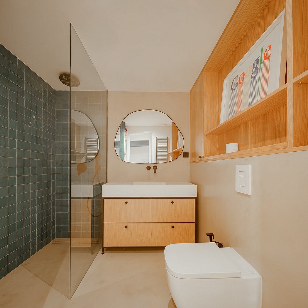 Warm-toned bathroom with clean-lined cabinetry, large mirrors, and a sleek shower.