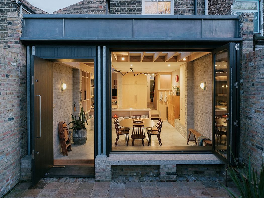 Inviting modern interior with wooden accents, circular dining table, and warm lighting.