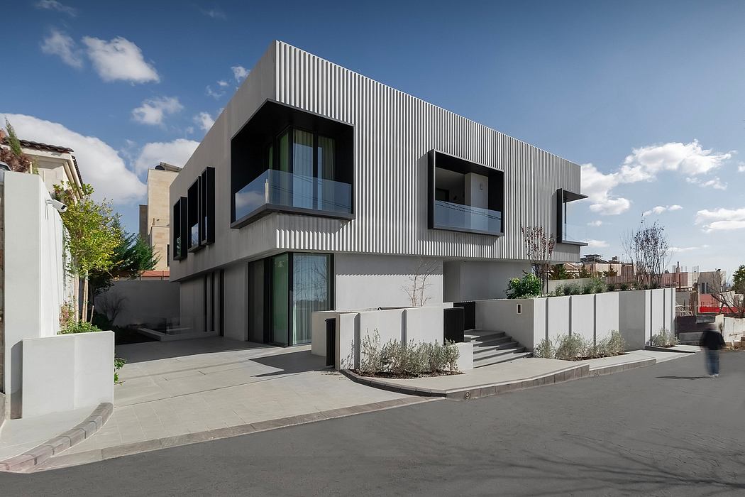 Striking modern architecture with bold vertical lines, glass, and stepped design.