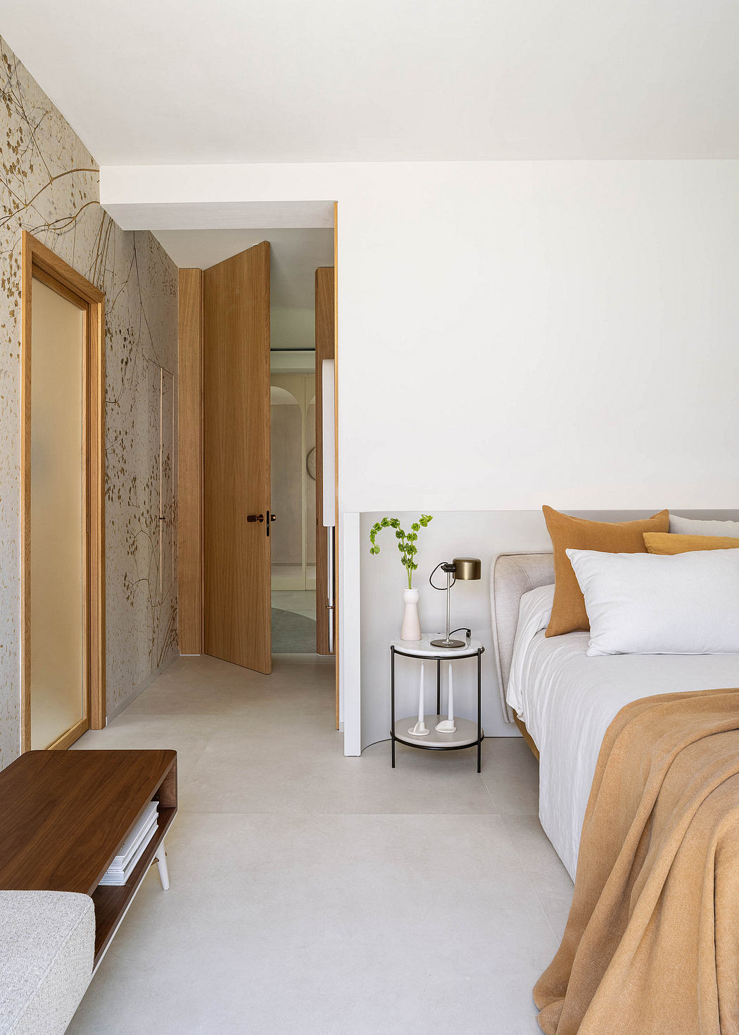 Cozy bedroom with clean lines, warm textures, and thoughtful decor elements.