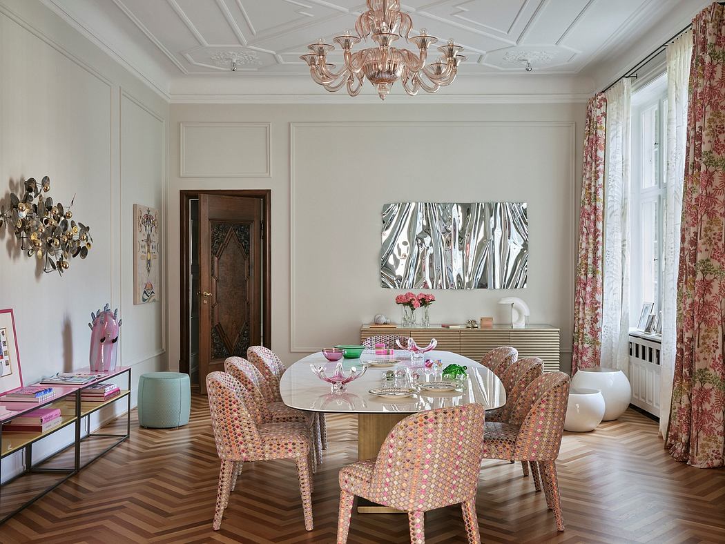 Ornate ceiling, crystal chandelier, patterned chairs, and artistic wall decor in elegant room.