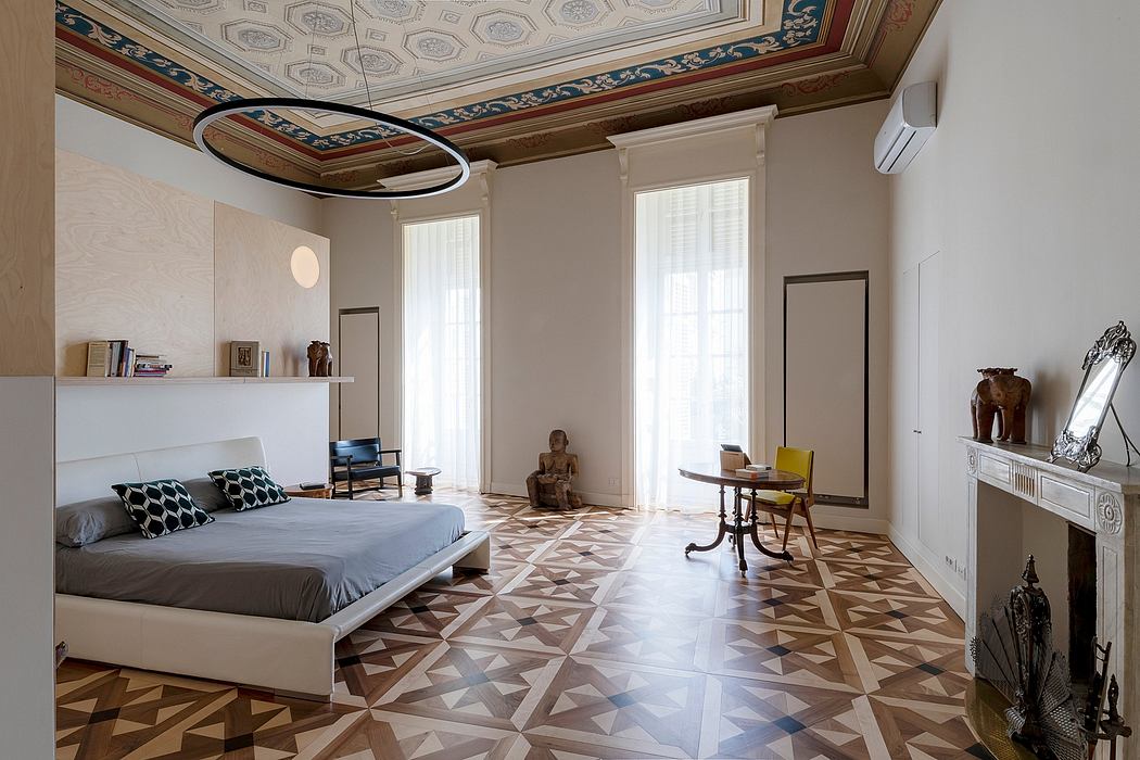 A grand, ornately decorated bedroom with patterned floors, high ceilings, and distinctive furnishings.