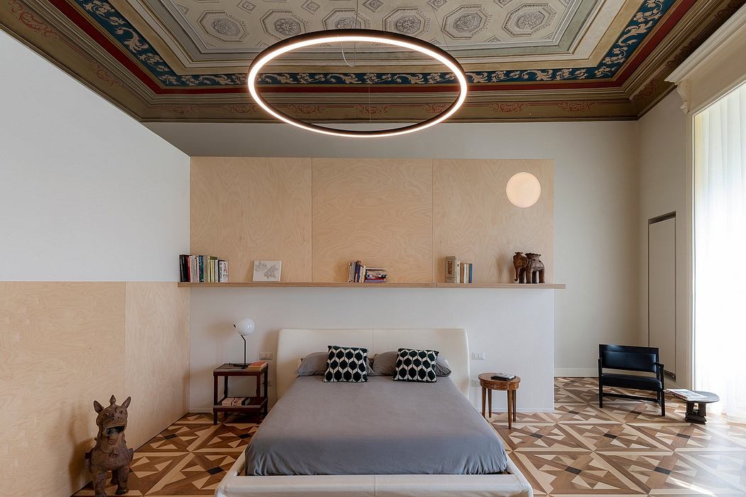 Ornate ceiling and geometric floor tiles complement the minimalist bedroom design.