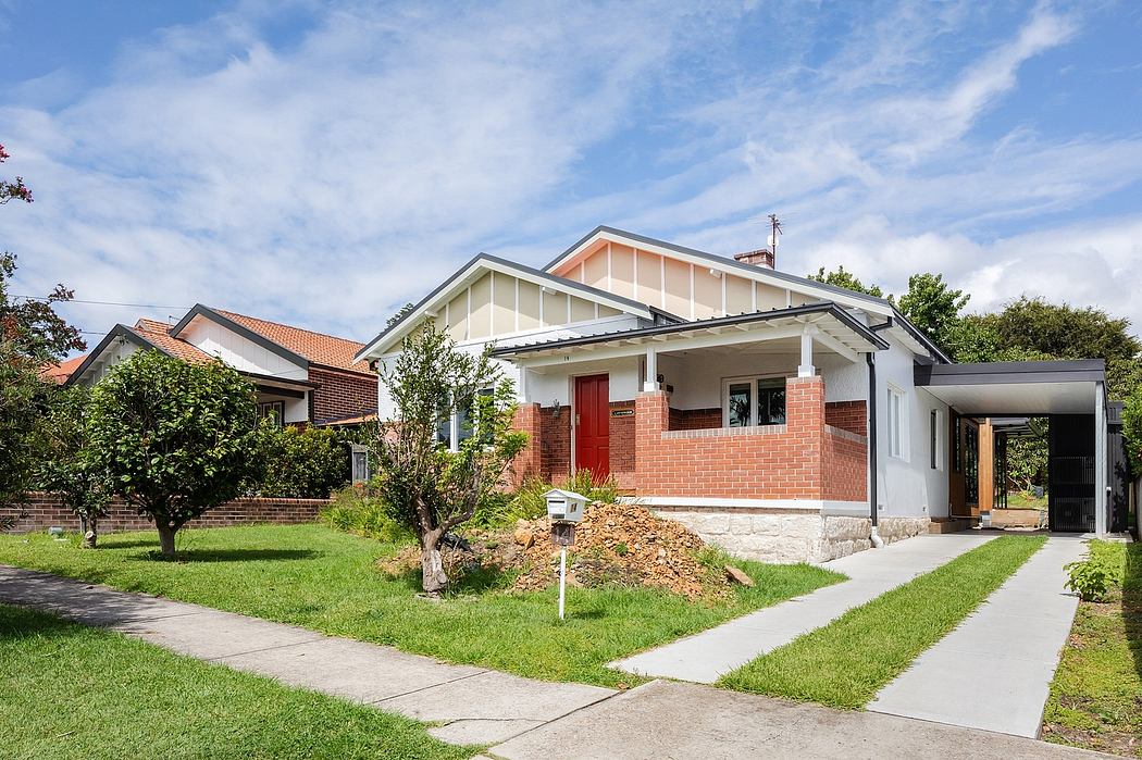 Well-maintained brick bungalow with prominent roof and inviting porch entrance.