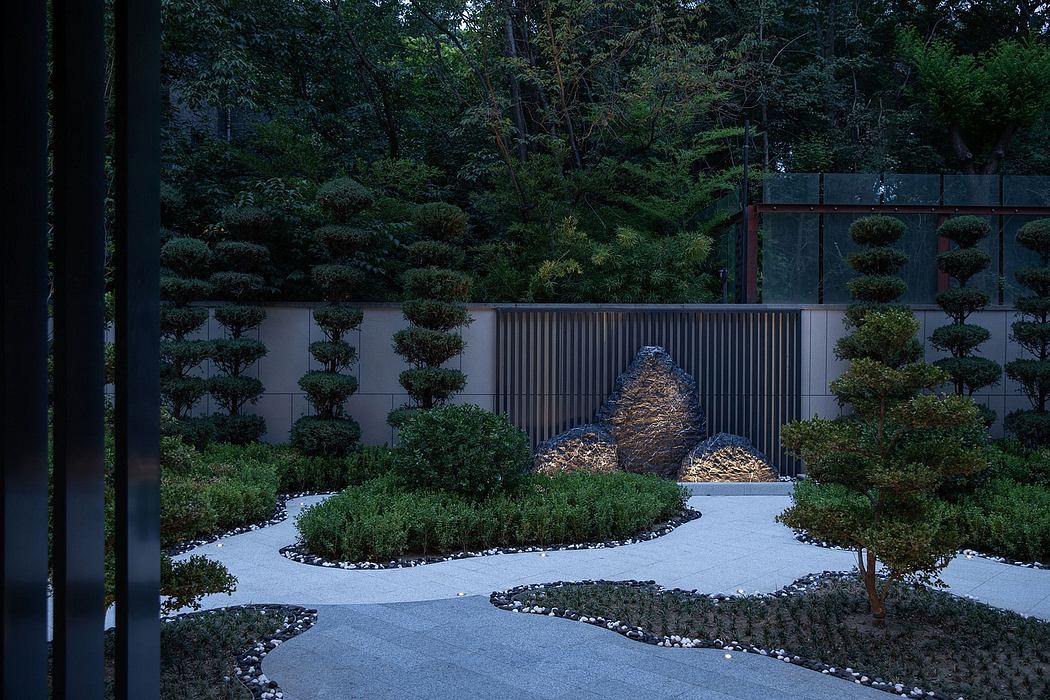 Serene Japanese-inspired garden with sculptural rock formations, gravel paths, and pruned shrubs.