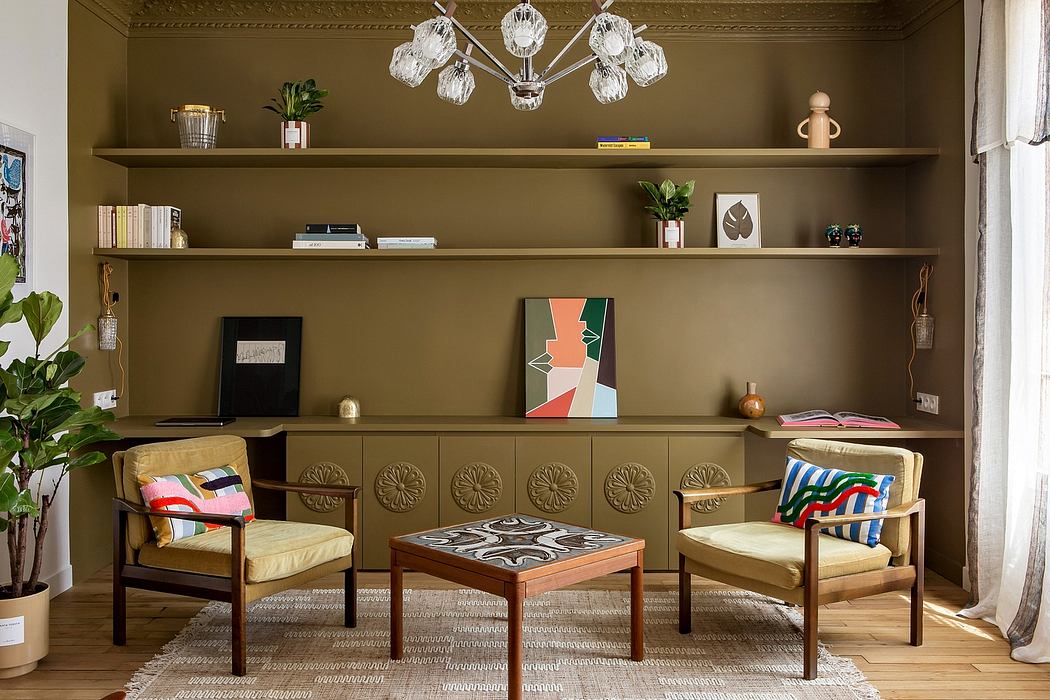 A cozy, eclectic living room with ornate shelving, plush seating, and a striking chandelier.