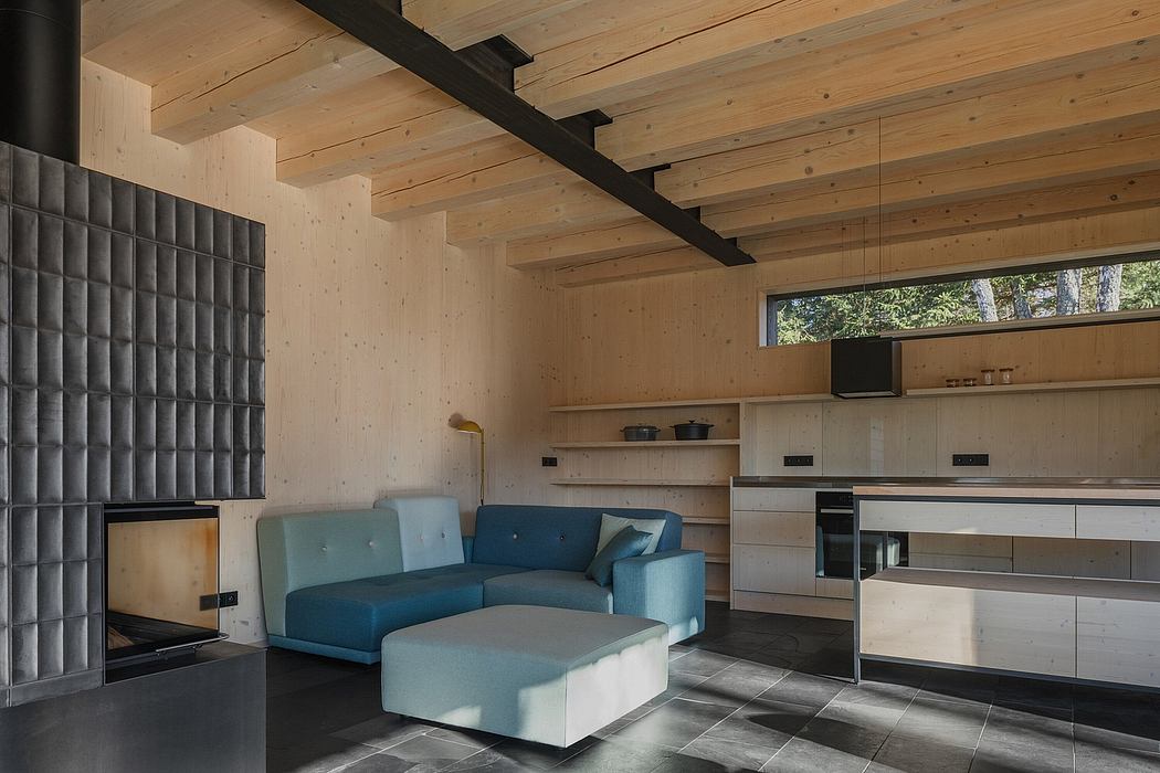 A cozy modern cabin with wooden walls, sleek furnishings, and a minimalist design.