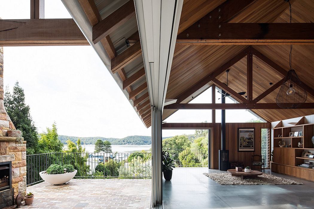 Stunning wood-beamed ceiling frames panoramic lake view through sliding glass doors.