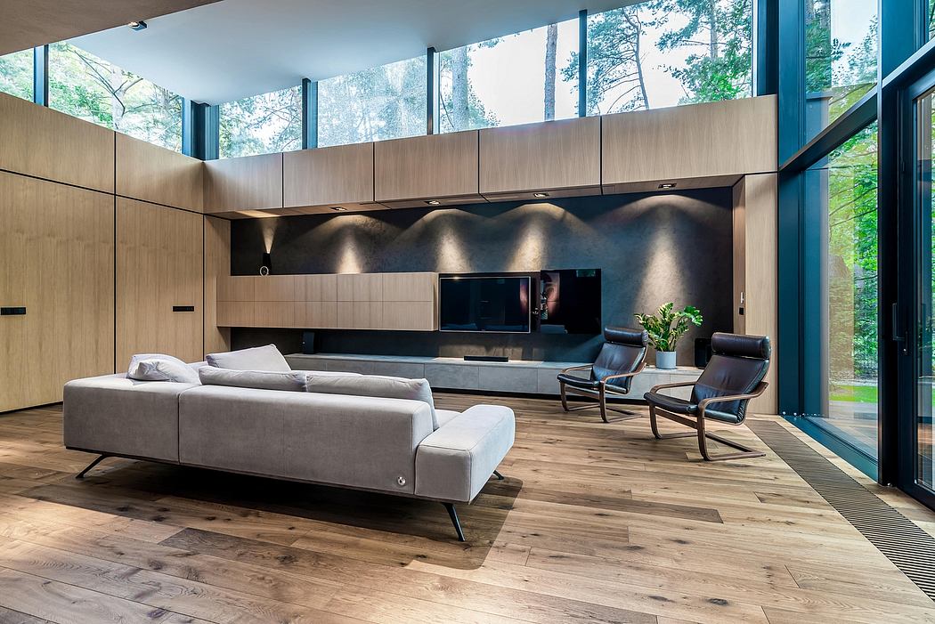 Spacious living room with floor-to-ceiling windows, sleek wood paneling, and modern furnishings.