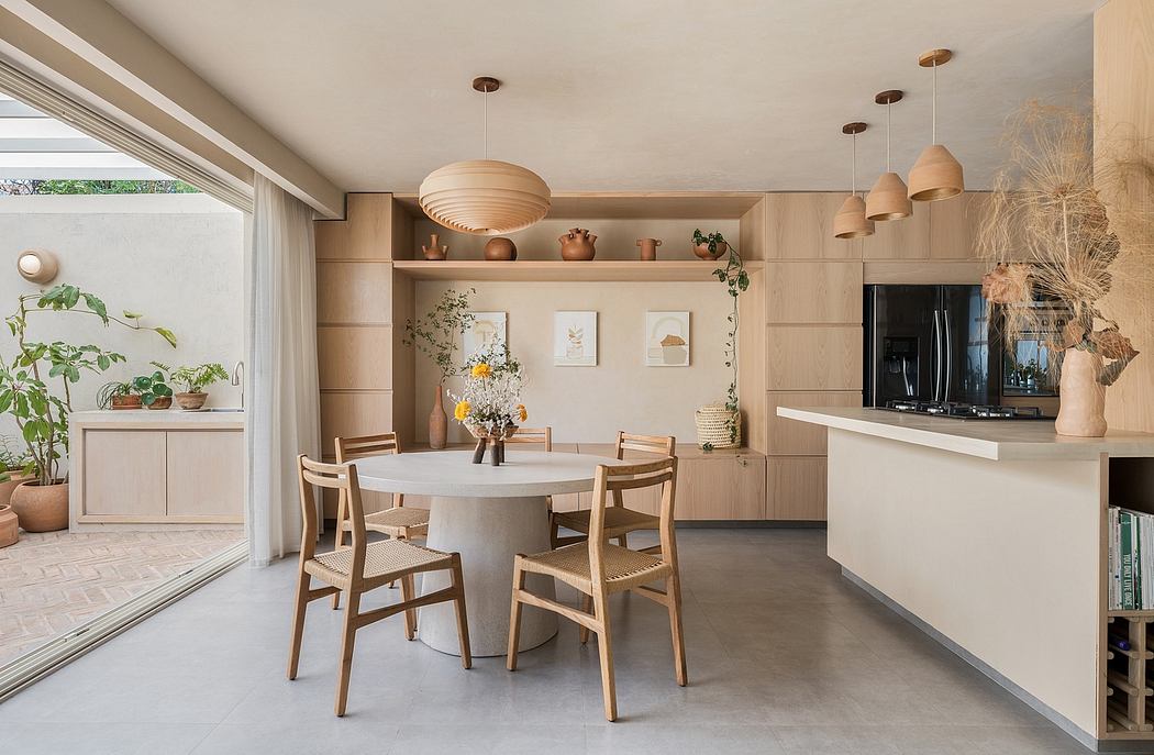 A cozy, light-filled dining area with natural wood furnishings and decor.