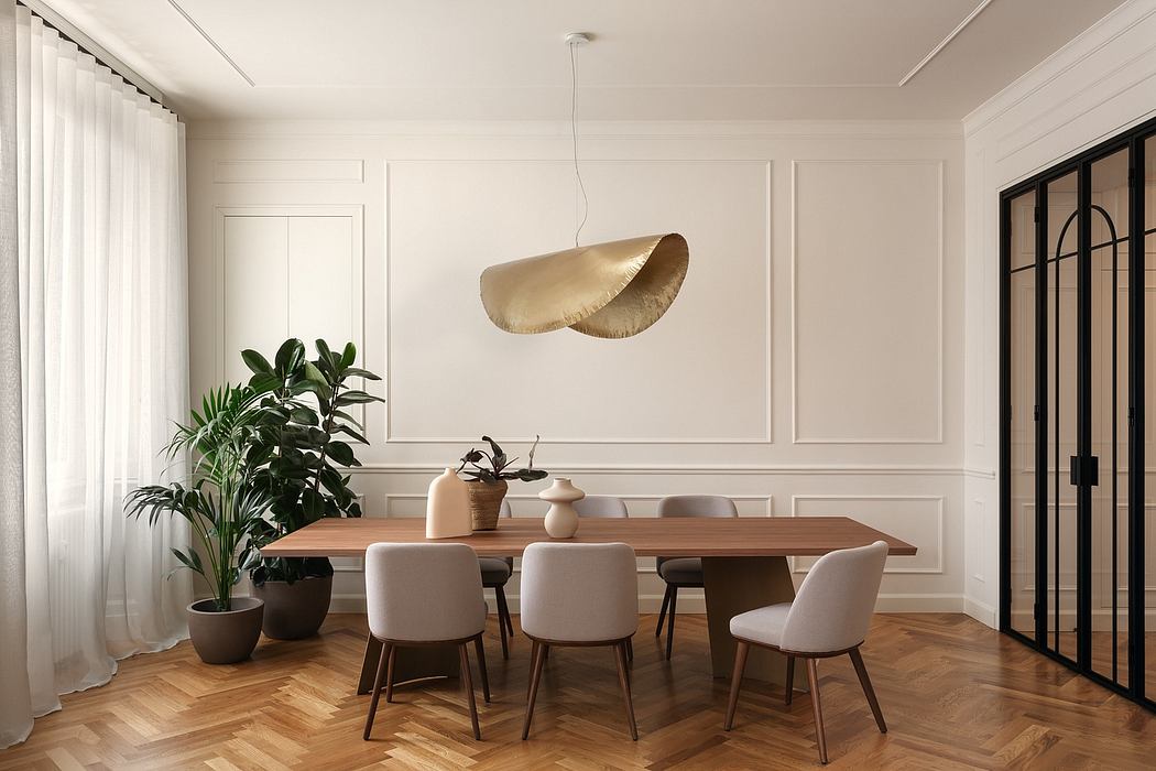 Elegant dining room with wood table, plush chairs, and a sculptural pendant light.