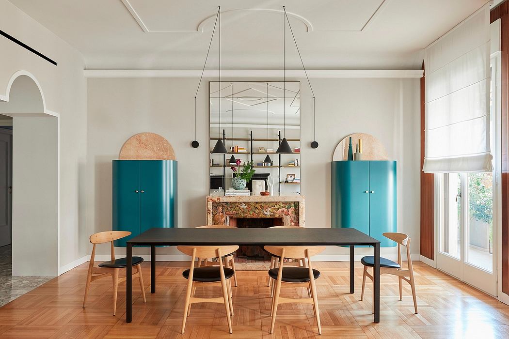Sleek modernist dining room with bold turquoise cabinets, arched shelving, and statement chandelier.