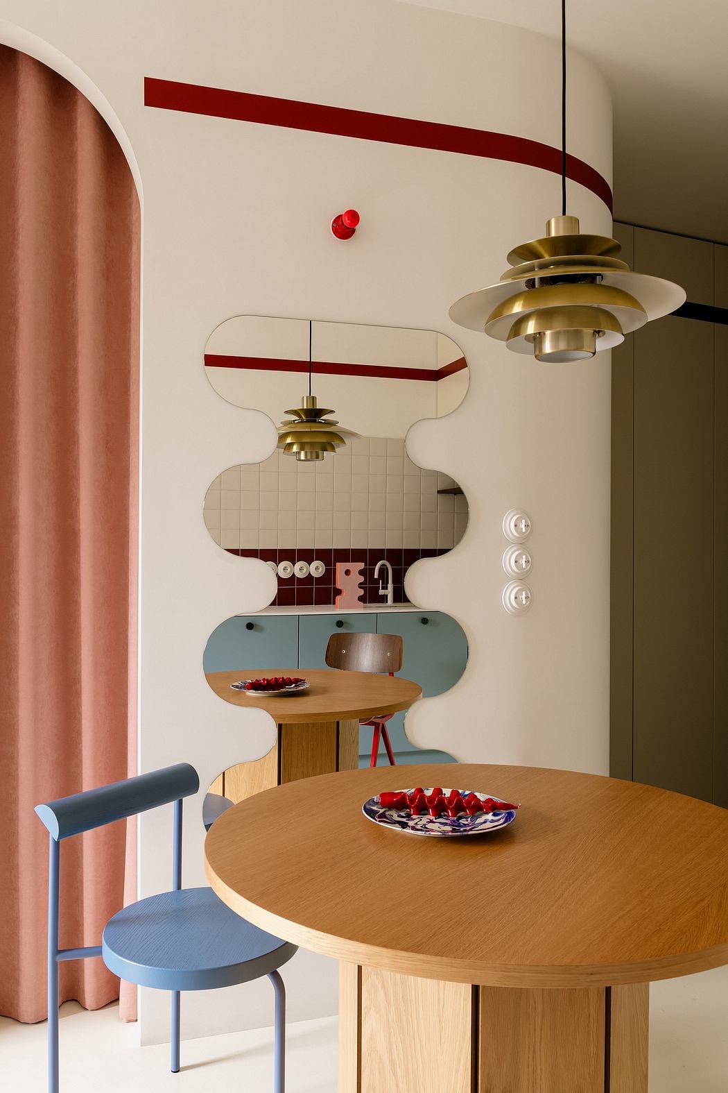 Modernist kitchen with geometric shapes, metallic fixtures, and minimalist furniture.