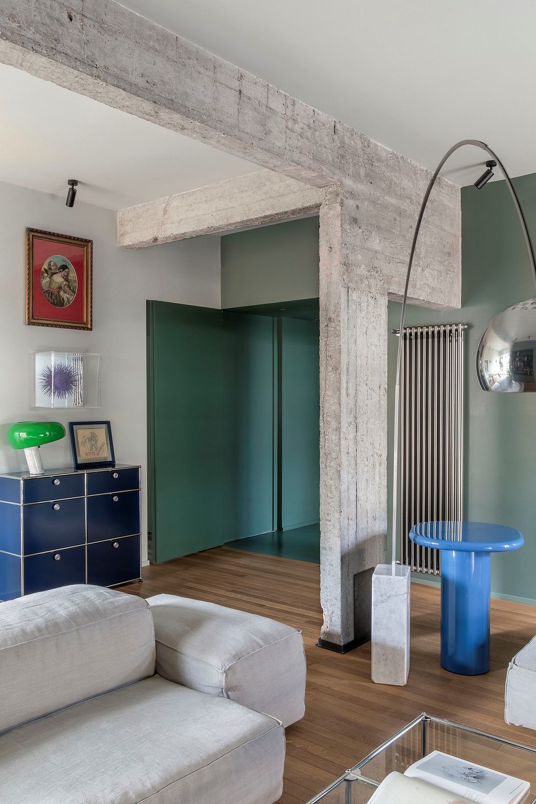 Eclectic interior with concrete beams, green panels, and modern furnishings.