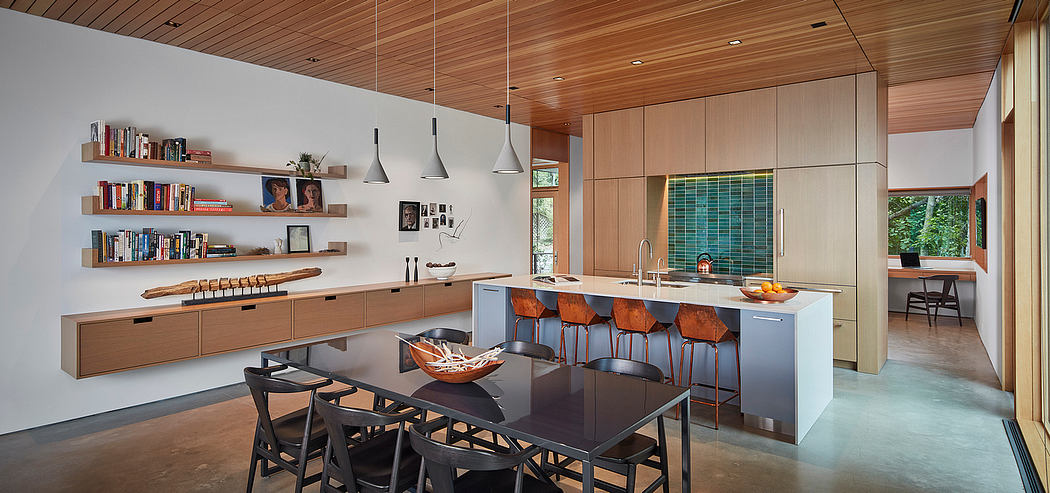 Expansive, well-designed kitchen and dining area with modern wooden elements.