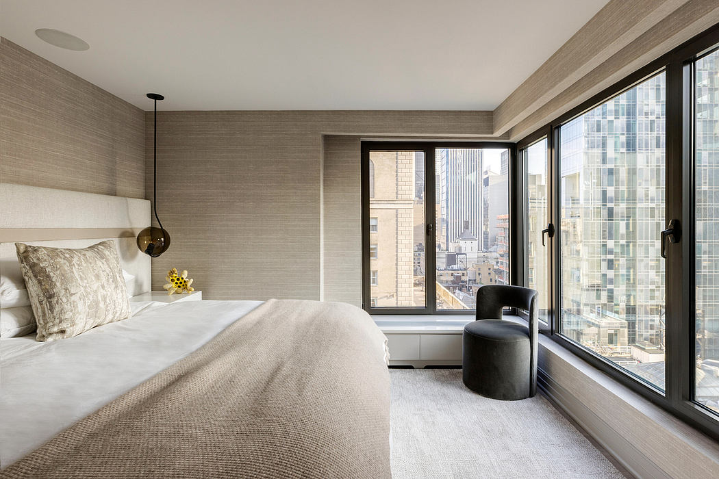 Minimalist bedroom with floor-to-ceiling windows overlooking the city skyline.