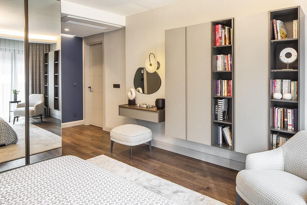 Elegant modern interior with minimalist shelving, mirror, and textured furnishings.