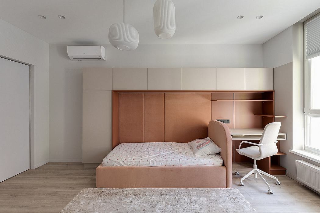 Minimalist bedroom with beige storage units, pendant lights, and a desk workspace.