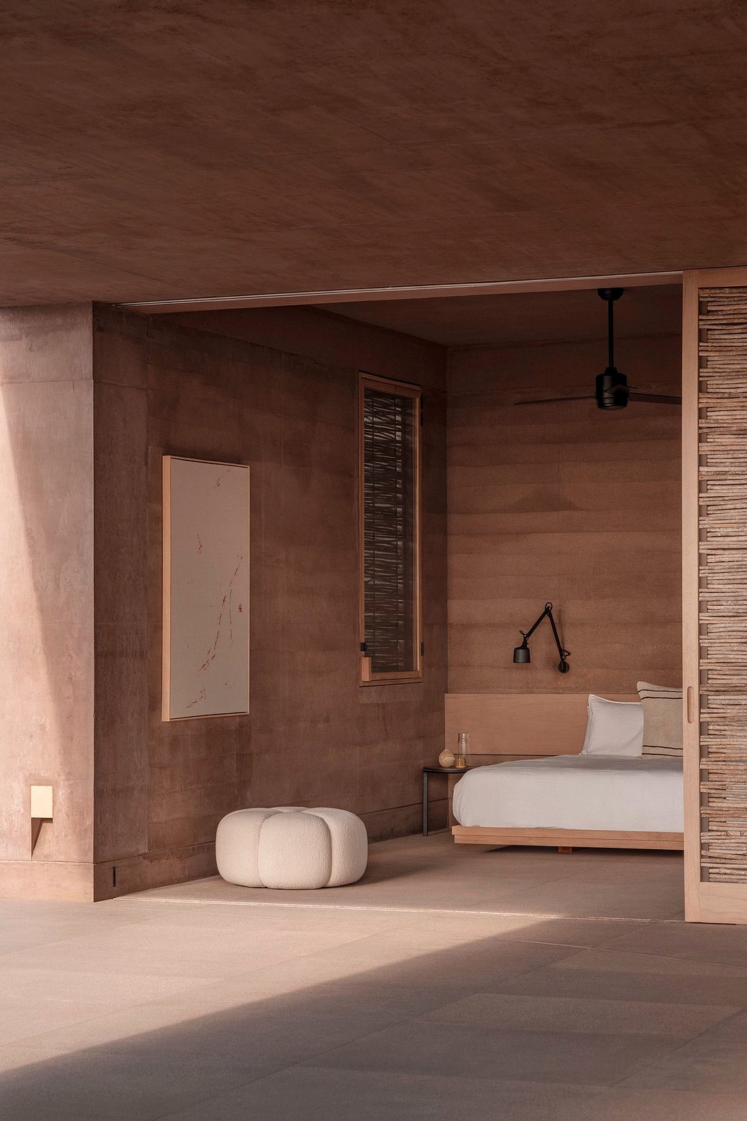 Warm, wooden bedroom with plush white furnishings and moody, atmospheric lighting.