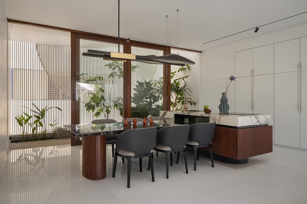 Elegant dining area with modern furnishings and a striking wooden frame surrounding the large window.
