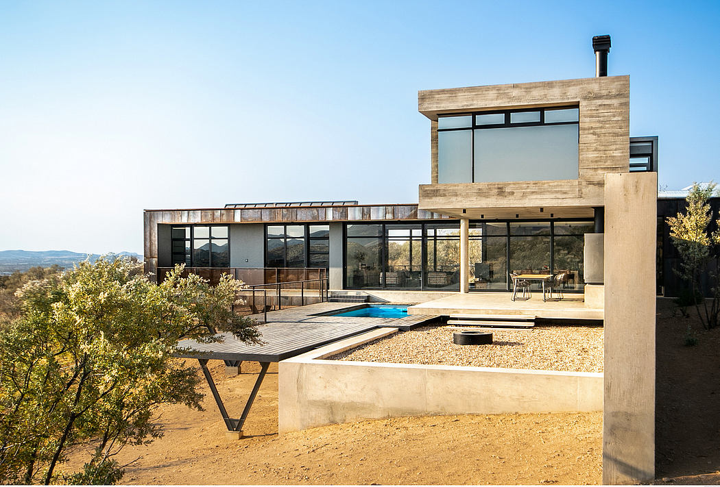 Modern hillside retreat featuring wooden accents, expansive windows, and a sleek pool.