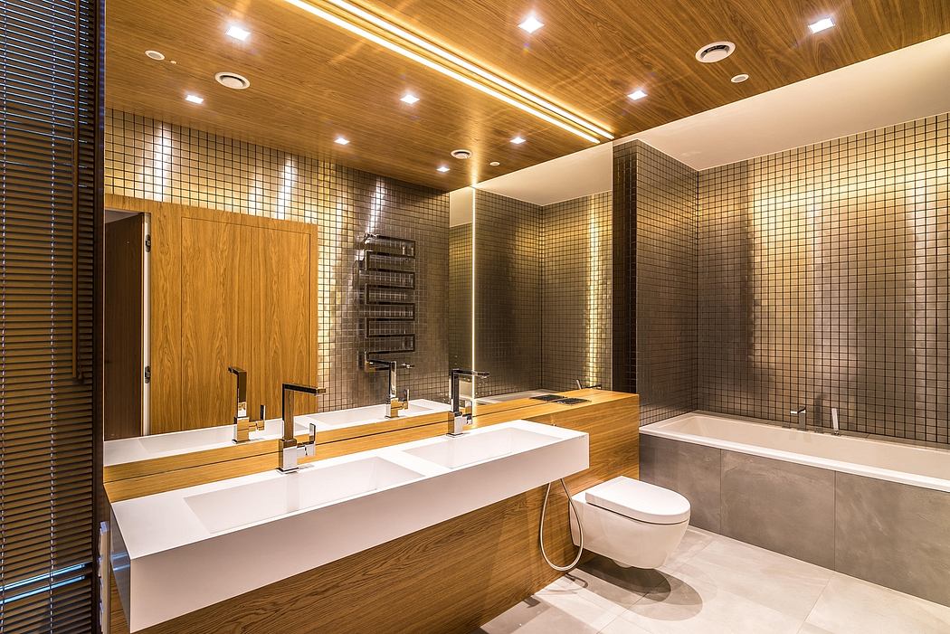 Modern bathroom with wood paneled ceiling, tiled walls, and vanity with dual sinks.