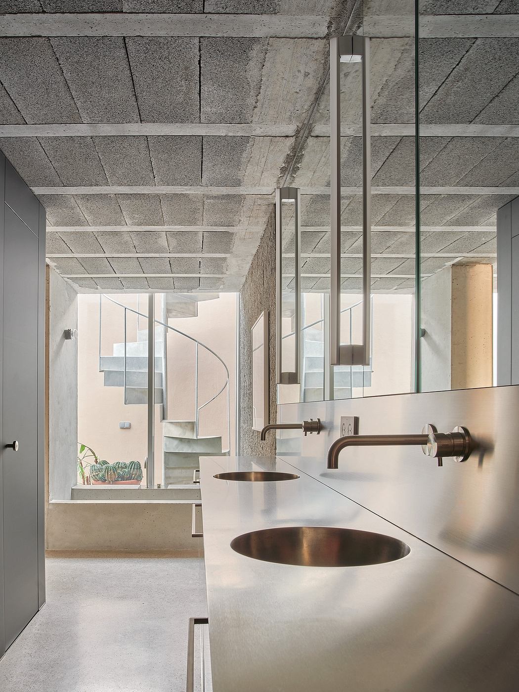 Minimalist bathroom with concrete ceiling, copper sinks, and floor-to-ceiling glass walls.