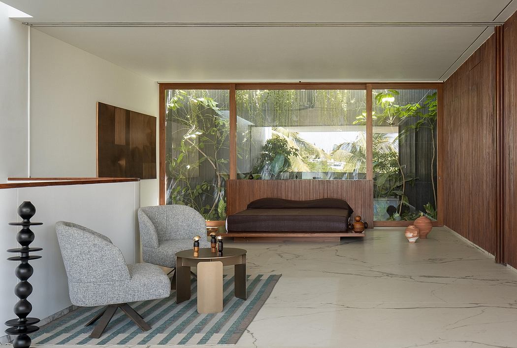 Sleek, modern living space with floor-to-ceiling windows, wood accents, and lush greenery.