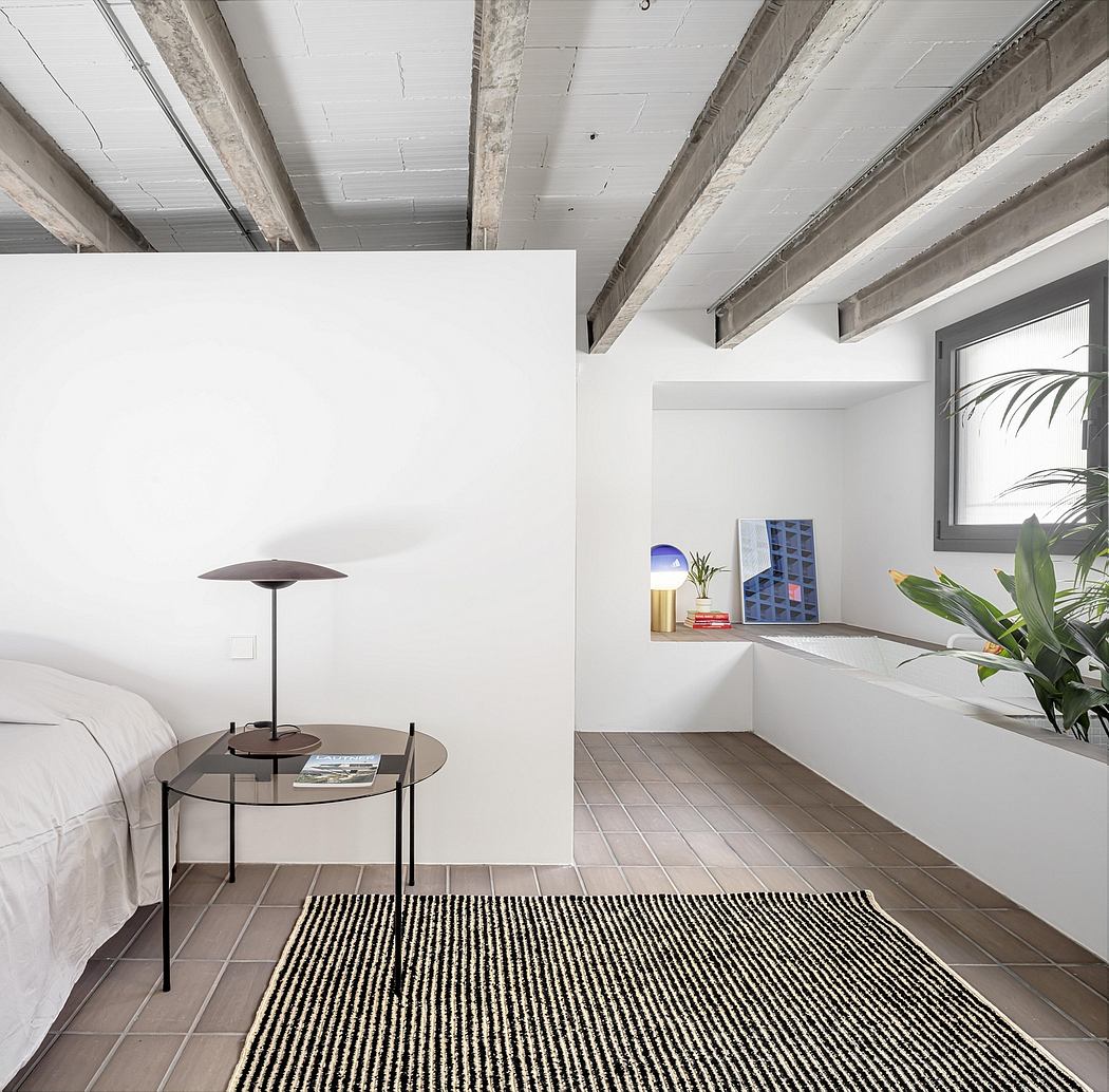 Minimalist bedroom with exposed wooden beams, tiled floor, and modern furniture.